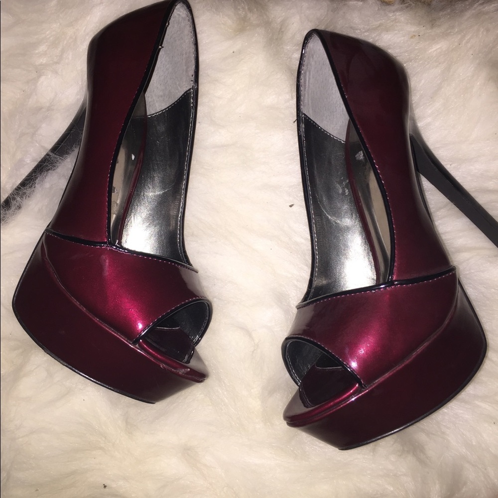 Deep burgundy peep toe platform shoes.